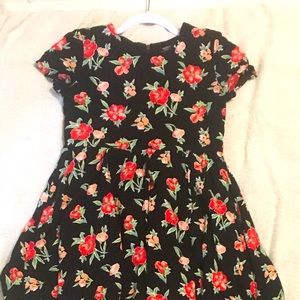 Knee-length black dress with red and pink flowers